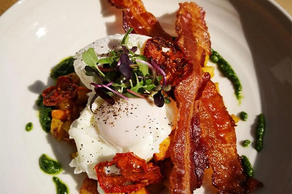 Cupanion's - Eggs, Hash, Kale, Bacon, Pesto | Photo: Facebook/cupanions | 4920 Roswell Rd Ste. 14, Sandy Springs, GA 30342