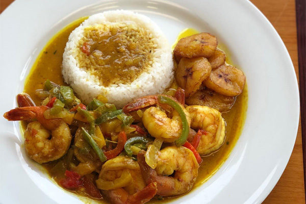 Irie Mon Cafe - Curried Shrimp | Photo: Facebook//iriemoncafe | 1800 Peachtree Rd NW #103, Atlanta, GA 30309