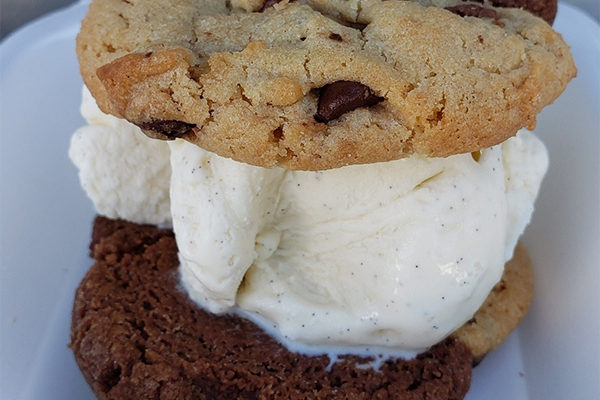 Not As Famous Cookie Sandwich showing classic vanilla ice cream, one of our featured black-owned restaurants in Atlanta | Photo: Courtesy of Not As Famous Cookie | 1080 Windy Hill Rd SE Suite 300, Smyrna, GA 30080