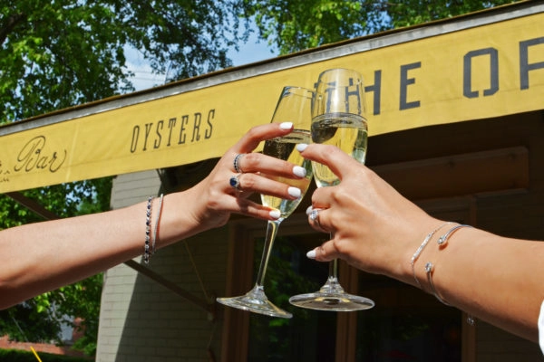 The Optimist Front Sign - Champagne Cheers | 914 Howell Mill Rd, Atlanta, GA 30318
