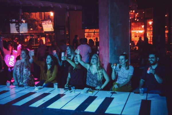Revelers drinking and enjoying the show at Park Bench at the Battery. | 900 Battery Ave SE Ste 1060, Atlanta, GA 30339