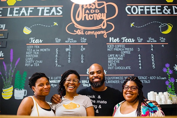 Just Add Honey Tea Interior, showing the team in our black-owned restaurants in Atlanta article | Photo: Facebook/justaddhoney | 684 John Wesley Dobbs Ave NE, Atlanta, GA 30312