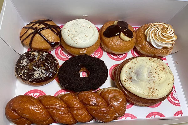 Eight pastries, including six donuts, a cinnamon bun, and a long twist | 3075 Ronald Reagan Blvd Suite 502, Cumming, GA 30041