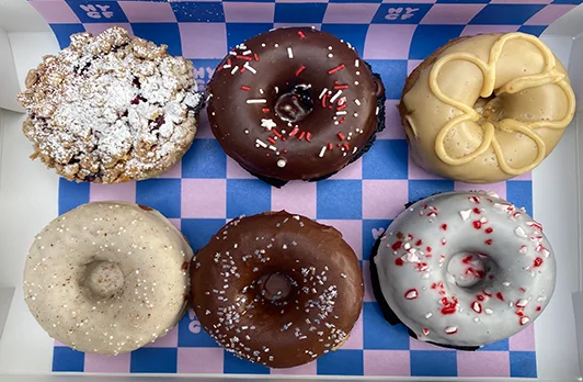 Six donuts of varying colors and toppings | 900 DeKalb Ave NE Suite 500, Atlanta, GA 30307