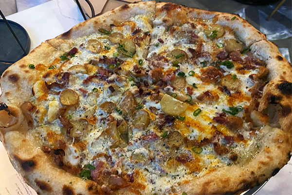 Pizza with potato, green onions, bacon, and cheese | 1115 Howell Mill Rd NW, Atlanta, GA 30318