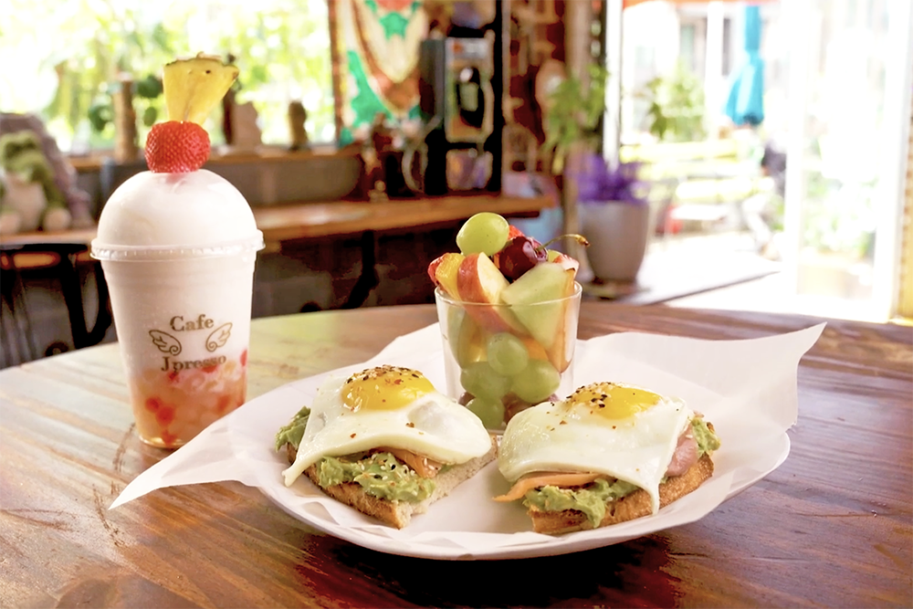 Avocado toast topped with a heart shaped poached egg from Jpresso